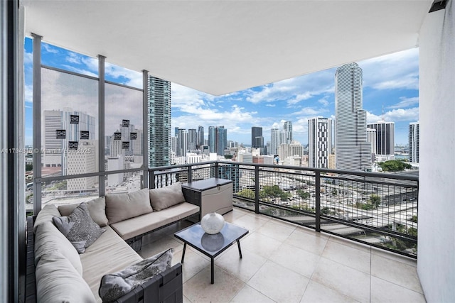 balcony featuring an outdoor living space and a city view