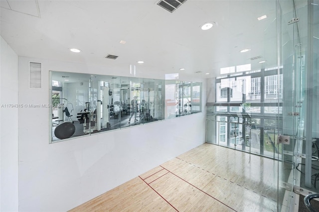 exercise room featuring recessed lighting and visible vents