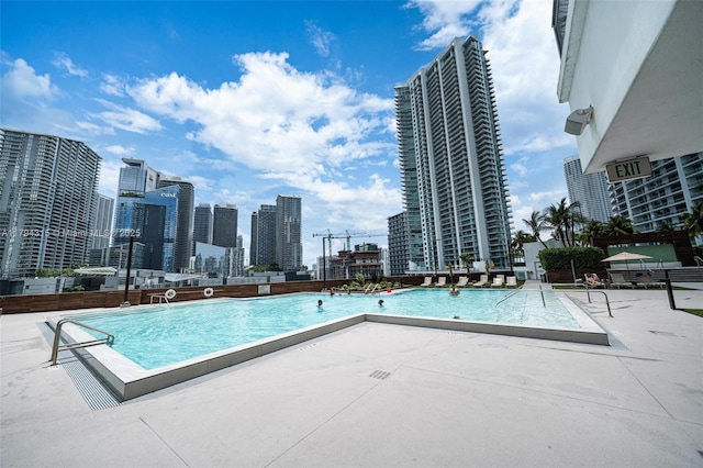 community pool with a city view