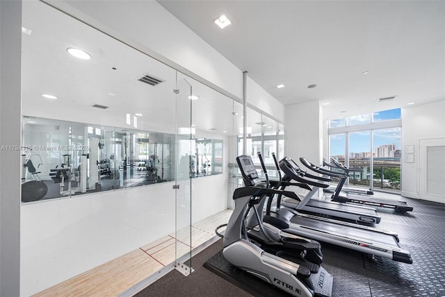 gym featuring carpet floors, recessed lighting, and visible vents