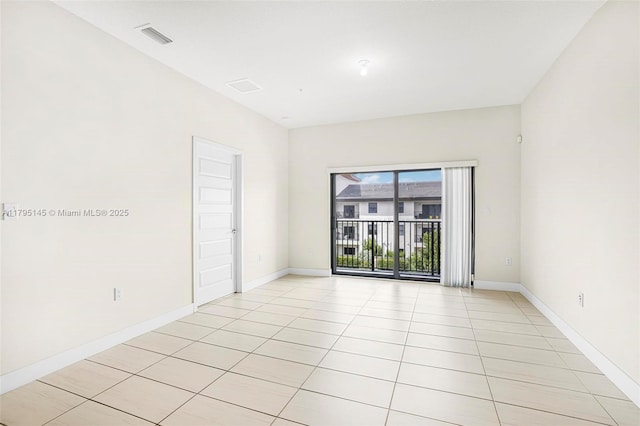 7865 NW 104th Ave Unit 33, Doral, FL 33178 - empty room featuring visible vents, baseboards, and light tile patterned floors
