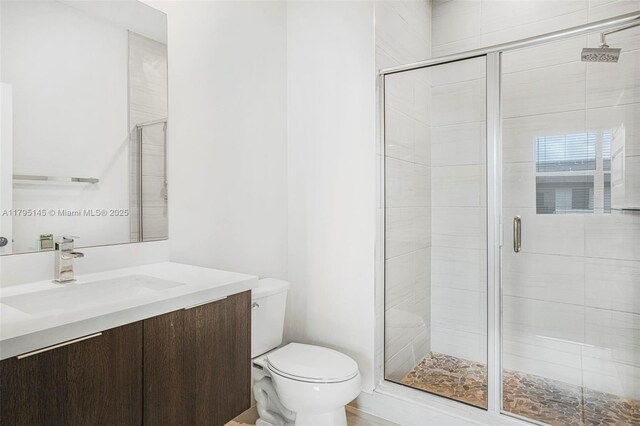 7865 NW 104th Ave Unit 33, Doral, FL 33178 - full bathroom with toilet, a shower stall, and vanity