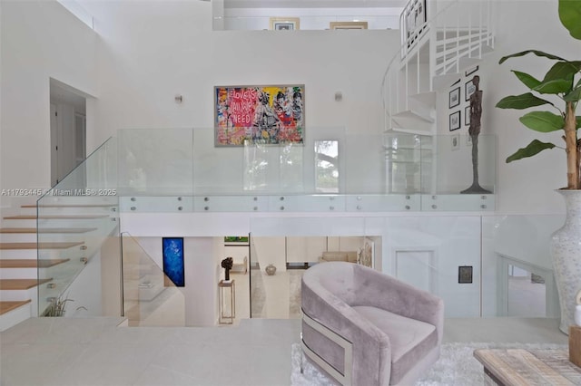 staircase with a high ceiling