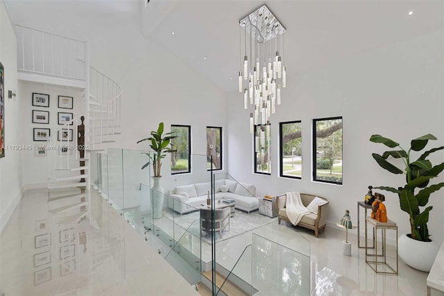 living area with stairs, recessed lighting, high vaulted ceiling, and baseboards
