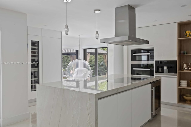 kitchen featuring island exhaust hood, modern cabinets, open shelves, double oven, and white cabinetry