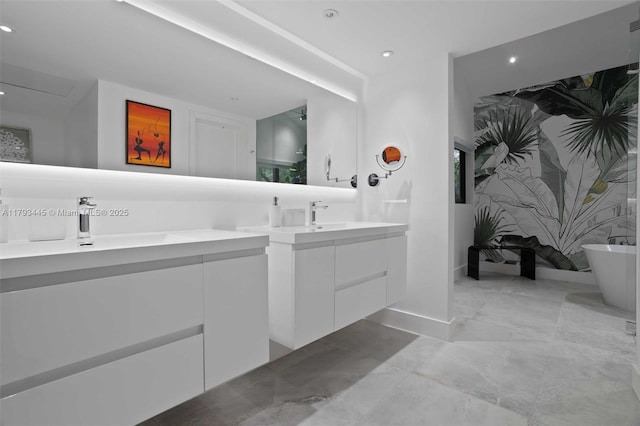 full bath featuring recessed lighting, a soaking tub, and vanity