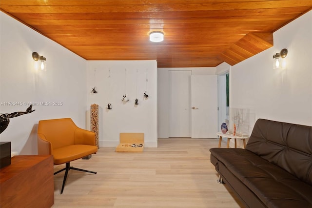 sitting room with wooden ceiling and light wood-style flooring