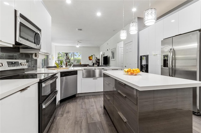kitchen featuring light countertops, modern cabinets, and stainless steel appliances