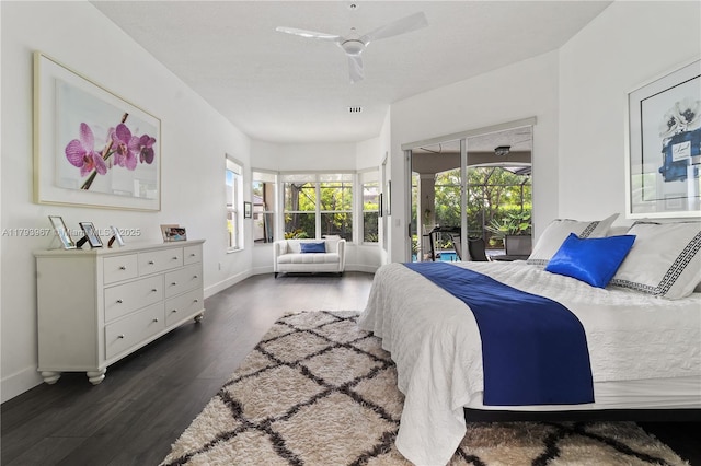 bedroom with access to exterior, a ceiling fan, baseboards, wood finished floors, and visible vents