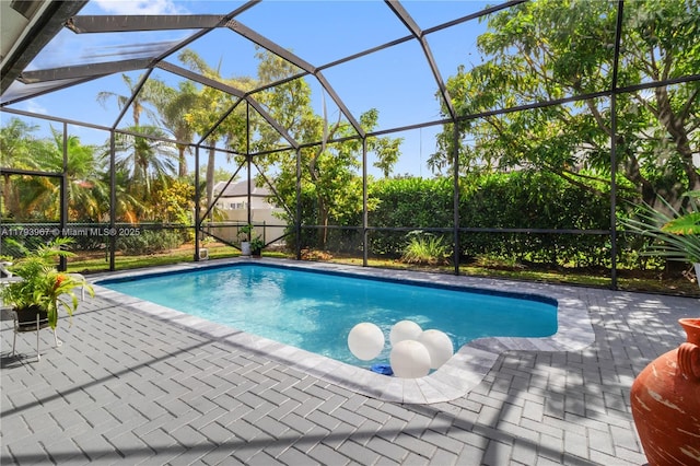 pool featuring a lanai and a patio area
