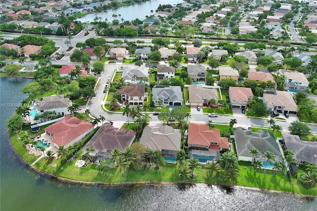 aerial view with a water view and a residential view