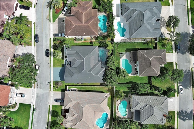 birds eye view of property with a residential view