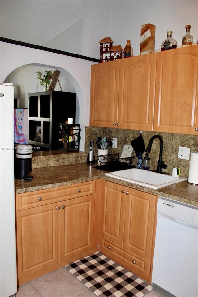 3638 NW 83rd Ln, Sunrise, FL 33351 - kitchen with white appliances, arched walkways, decorative backsplash, and a sink