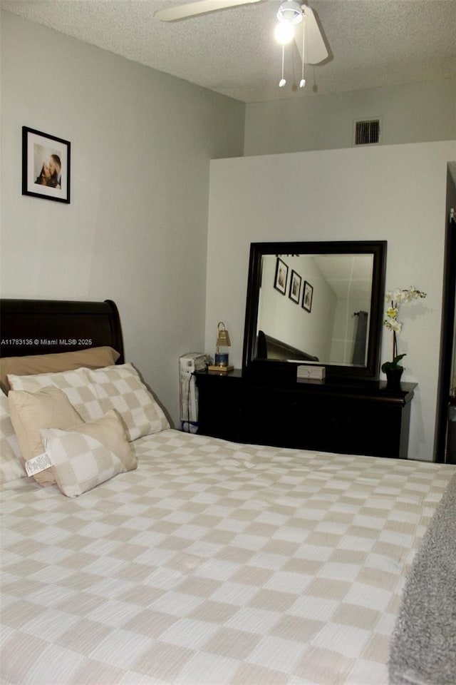 3638 NW 83rd Ln, Sunrise, FL 33351 - bedroom with carpet flooring, a textured ceiling, visible vents, and ceiling fan