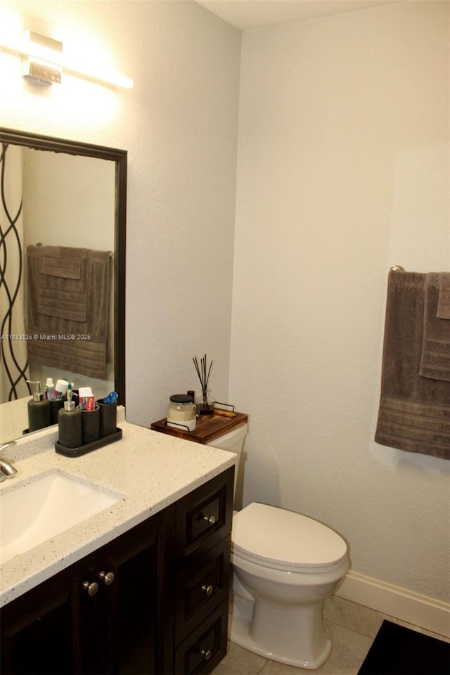 3638 NW 83rd Ln, Sunrise, FL 33351 - bathroom featuring tile patterned flooring, baseboards, toilet, and vanity