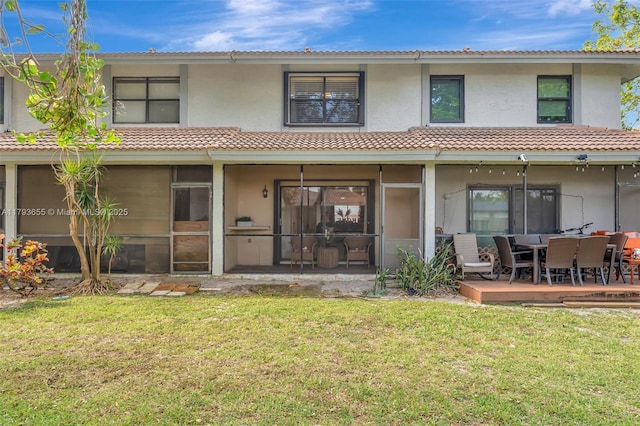 9829 Riverside Dr Unit 42-6, Coral Springs, FL 33071 - back of house with a tiled roof, a yard, and stucco siding