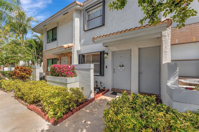 9829 Riverside Dr Unit 42-6, Coral Springs, FL 33071 - property entrance with stucco siding and a tile roof