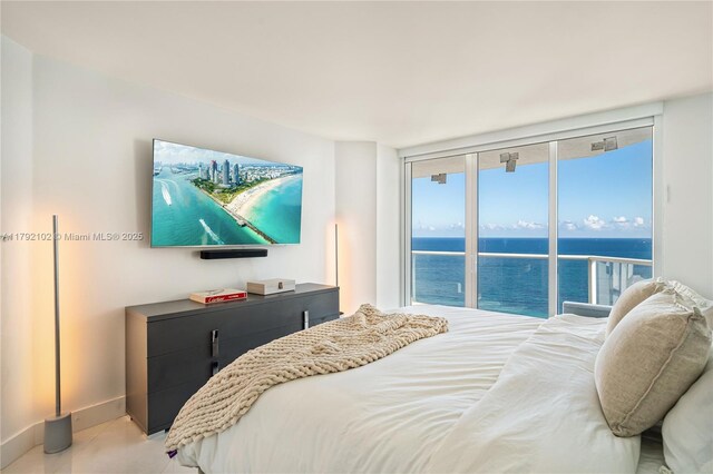 16485 Collins Ave Unit 2438, Sunny Isles Beach, FL 33160 - bedroom featuring baseboards and access to outside