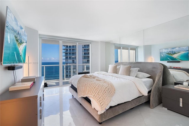 16485 Collins Ave Unit 2438, Sunny Isles Beach, FL 33160 - bedroom featuring expansive windows, light tile patterned floors, and access to exterior