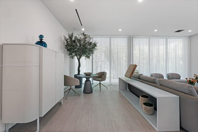 310 W Dilido Dr, Miami Beach, FL 33139 - living room featuring recessed lighting, floor to ceiling windows, and wood finished floors
