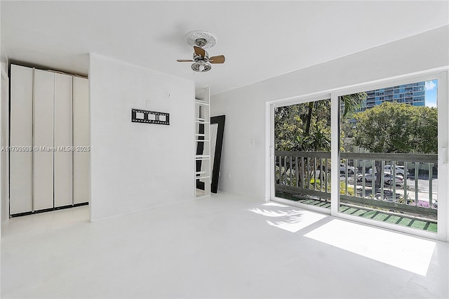 517 NE 38th St Unit 9, Miami, FL 33137 - spare room with a ceiling fan and finished concrete flooring