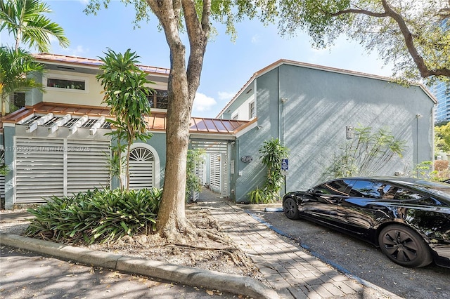 517 NE 38th St Unit 9, Miami, FL 33137 - multi unit property with a standing seam roof, metal roof, and stucco siding