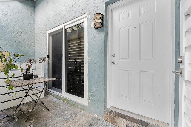 517 NE 38th St Unit 9, Miami, FL 33137 - doorway to property with stucco siding