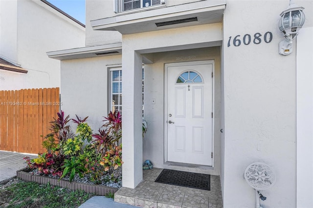 16080 SW 138th Pl, Miami, FL 33177 - doorway to property with stucco siding