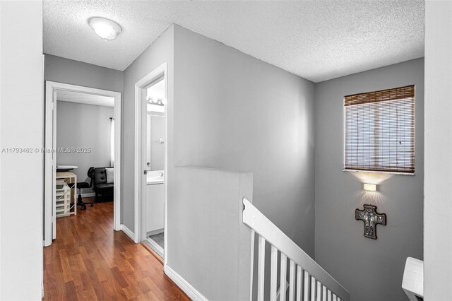 16080 SW 138th Pl, Miami, FL 33177 - hallway with an upstairs landing, a textured ceiling, and wood finished floors