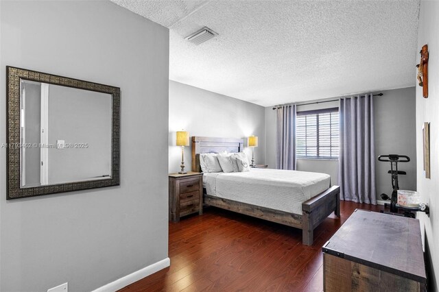 16080 SW 138th Pl, Miami, FL 33177 - bedroom with a textured ceiling and dark wood-type flooring