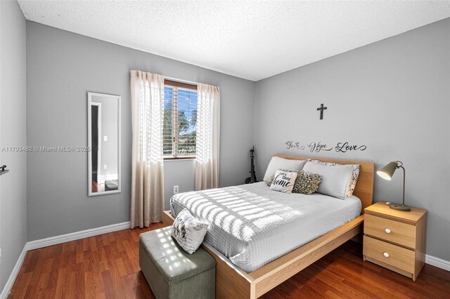 16080 SW 138th Pl, Miami, FL 33177 - bedroom featuring wood finished floors and a textured ceiling