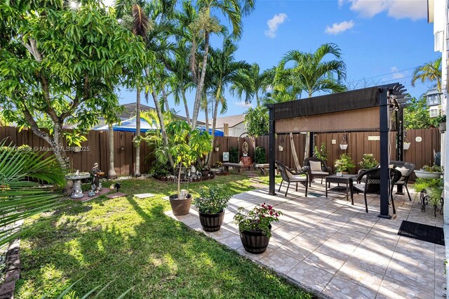 16080 SW 138th Pl, Miami, FL 33177 - fenced backyard with a patio and an outdoor hangout area
