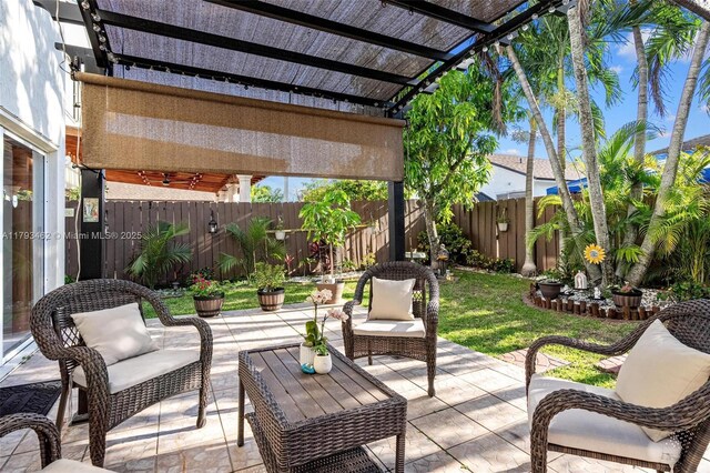 16080 SW 138th Pl, Miami, FL 33177 - fenced backyard featuring a patio area, a pergola, and an outdoor living space