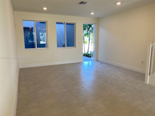 10250 NW 66th St Unit 103, Doral, FL 33178 - spare room featuring recessed lighting, baseboards, visible vents, and tile patterned floors