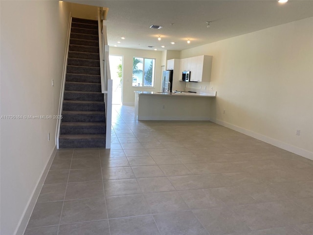 10250 NW 66th St Unit 103, Doral, FL 33178 - interior space featuring baseboards, recessed lighting, stairs, and light tile patterned floors