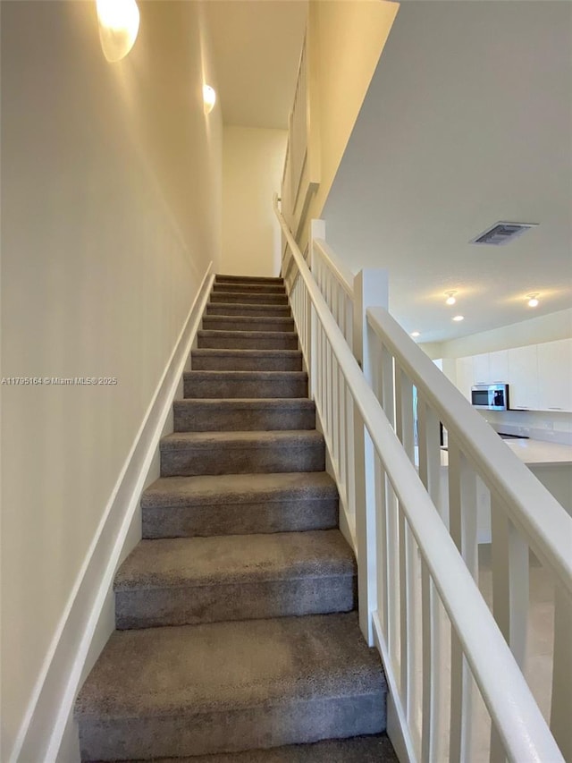 10250 NW 66th St Unit 103, Doral, FL 33178 - staircase with carpet flooring, recessed lighting, and visible vents