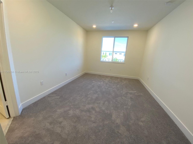 10250 NW 66th St Unit 103, Doral, FL 33178 - spare room featuring baseboards, carpet flooring, and recessed lighting