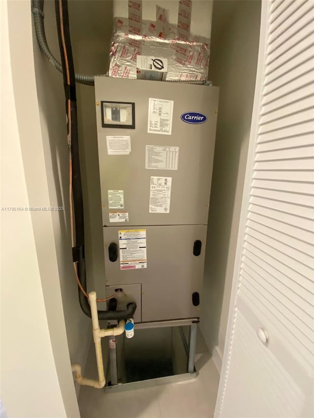 10250 NW 66th St Unit 103, Doral, FL 33178 - utility room featuring heating unit