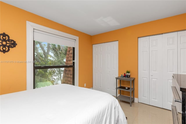 8956 Palm Tree Ln Unit 8956, Pembroke Pines, FL 33024 - bedroom with two closets and light tile patterned flooring