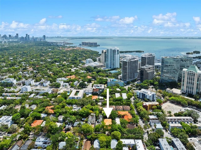 birds eye view of property with a view of city and a water view