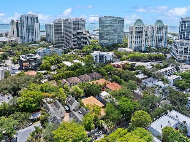 drone / aerial view featuring a water view and a city view