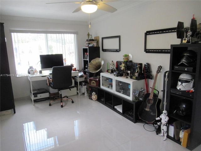 office space featuring a ceiling fan, tile patterned floors, and ornamental molding
