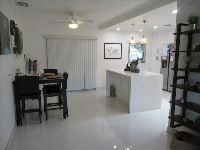 interior space featuring a ceiling fan, visible vents, light tile patterned floors, and recessed lighting