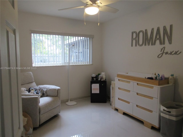 living area with ceiling fan