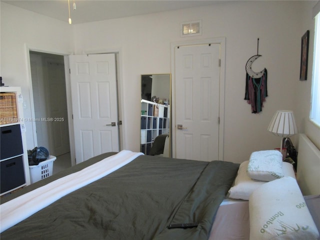 bedroom with visible vents