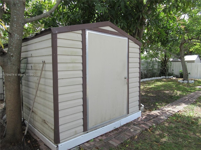 view of shed with fence