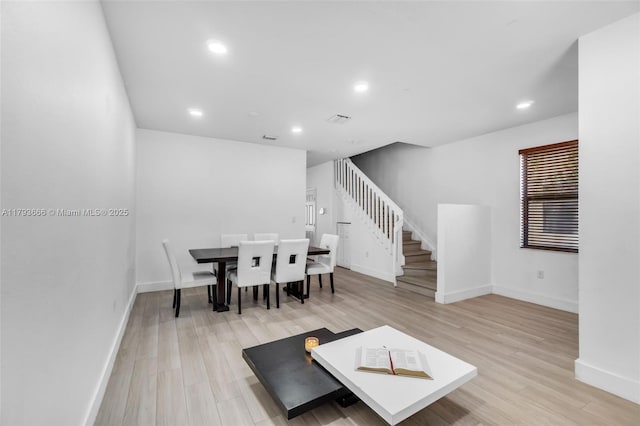 living room featuring visible vents, recessed lighting, stairway, light wood-style flooring, and baseboards