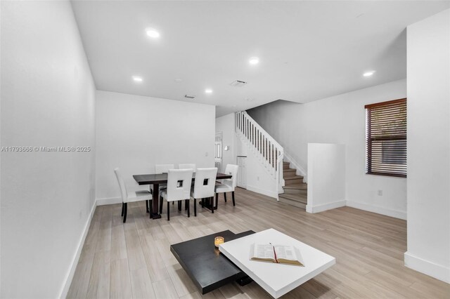 9371 W 33rd Ave, Hialeah, FL 33018 - living room featuring baseboards, light wood-type flooring, stairs, and recessed lighting