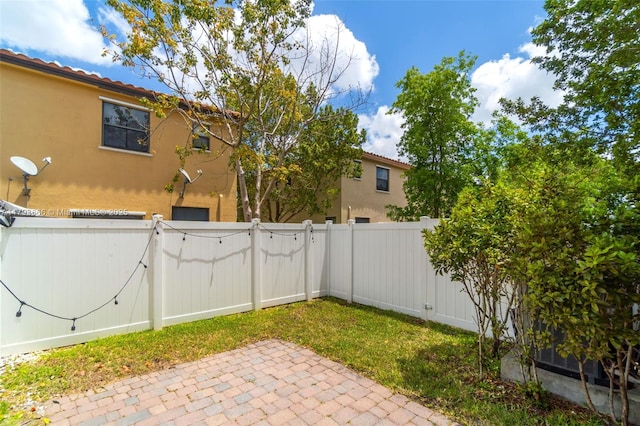 9371 W 33rd Ave, Hialeah, FL 33018 - fenced backyard with a gate and a patio area