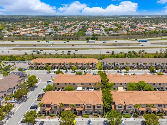 birds eye view of property with a residential view